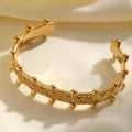 Gold studded hand cuff